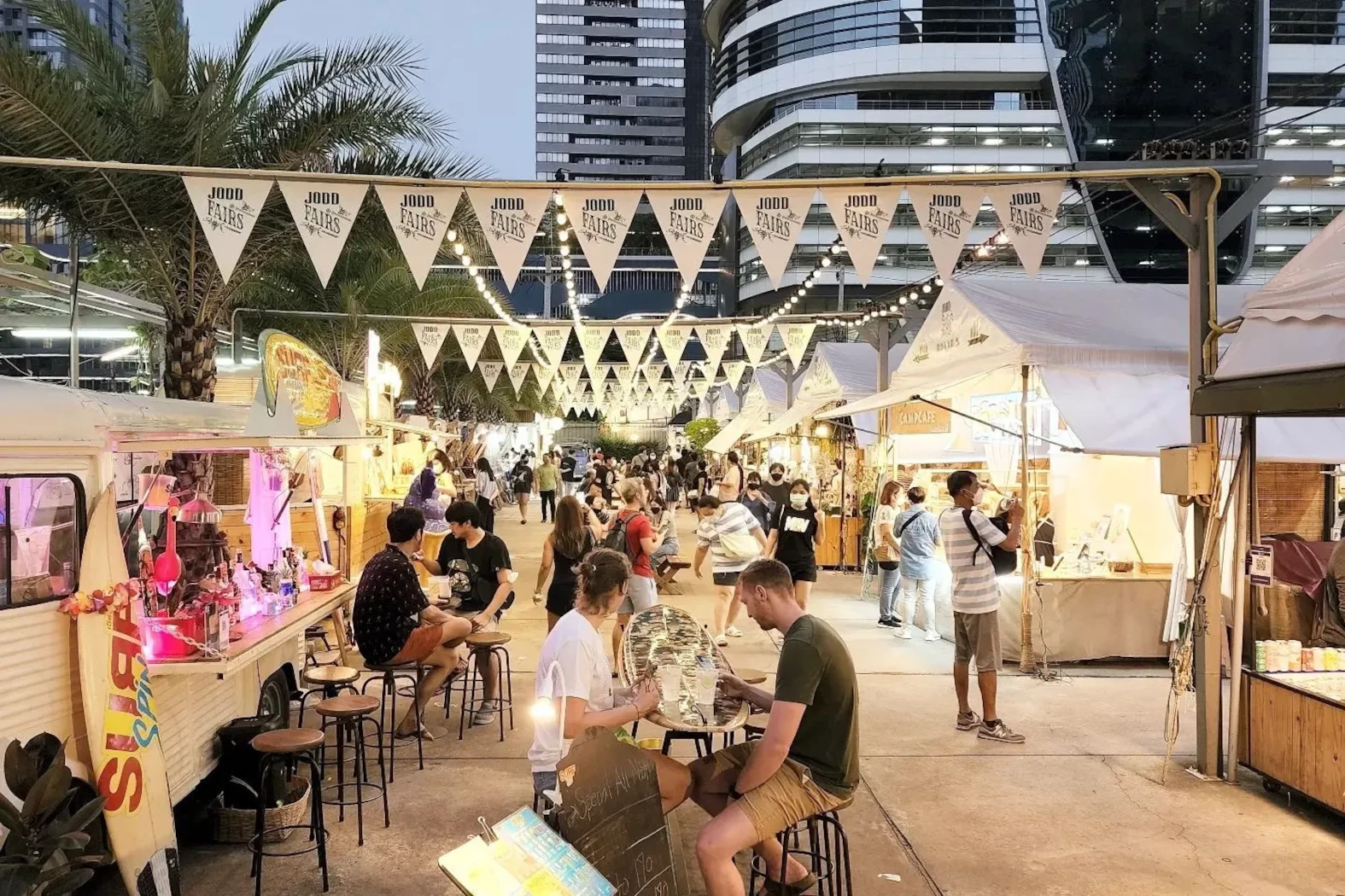 the beautiful night market Jodd Fairs in Bangkok with people in date