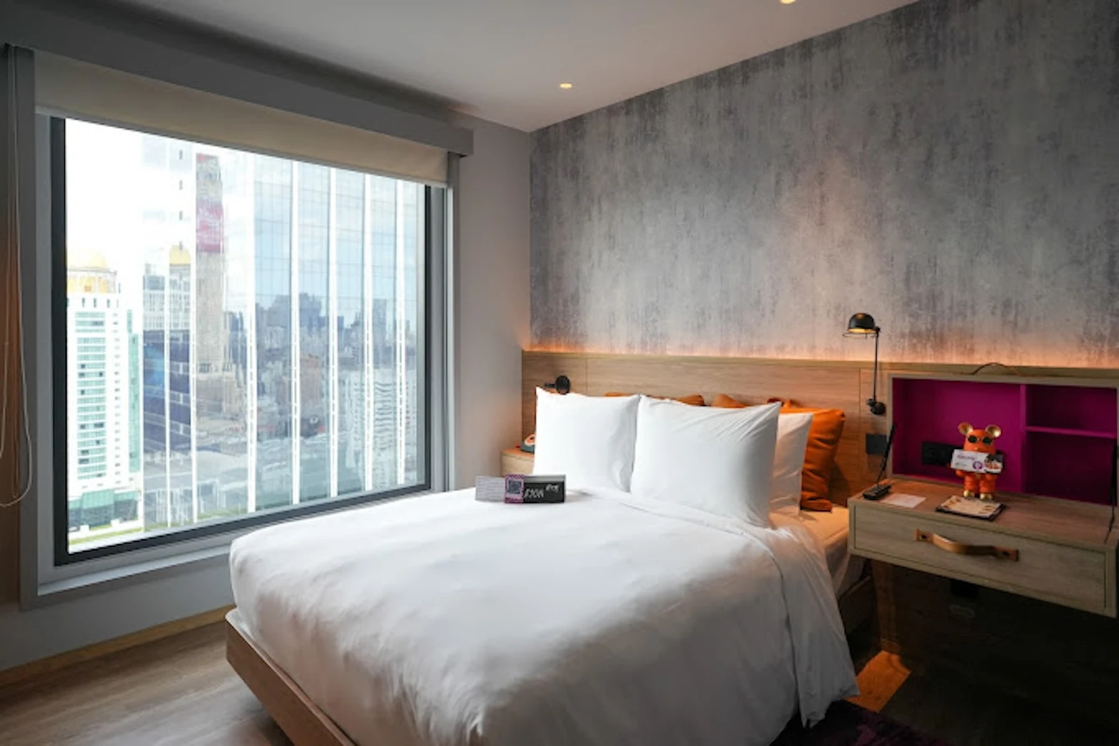 this is a bedroom of Moxy Bangkok Ratchaprasong hotel